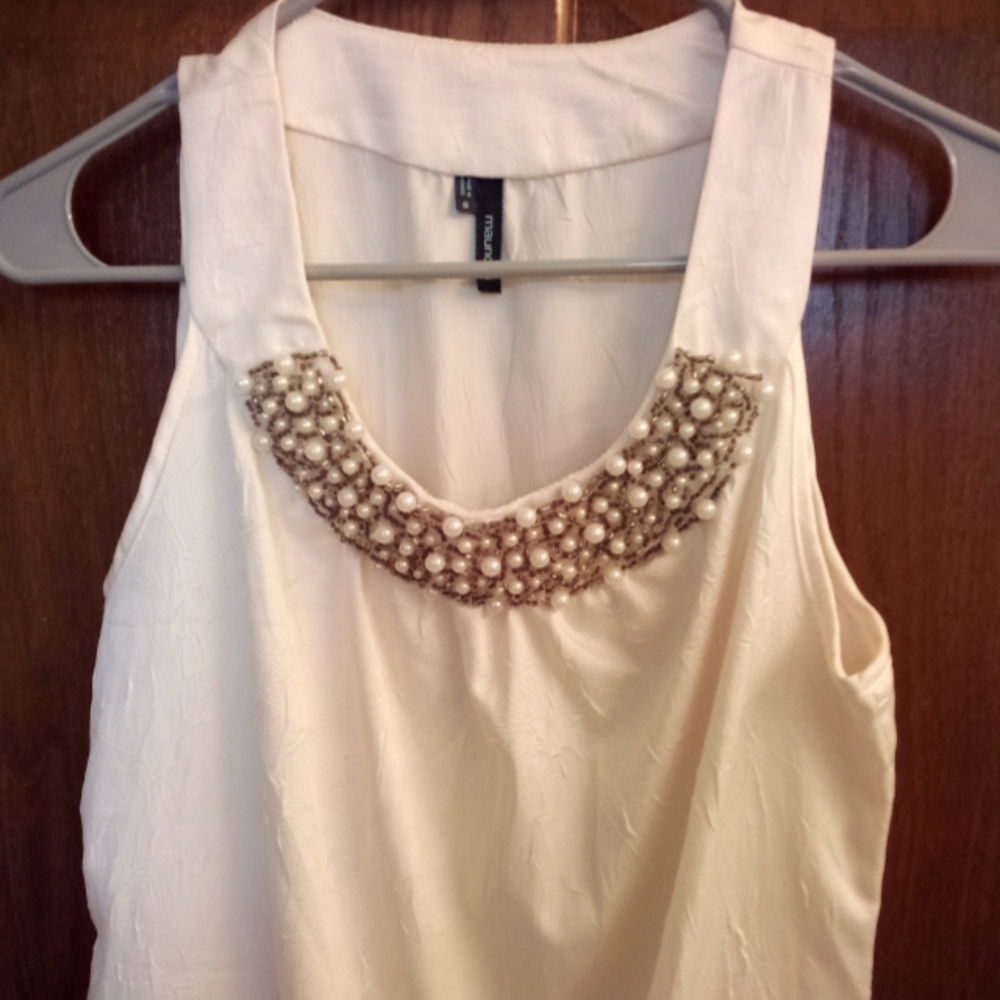 Silky tank top with pearls/beading at neck.